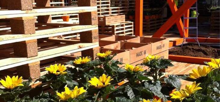 a flower show garden with yellow flowers and an ethiopian coffee theme